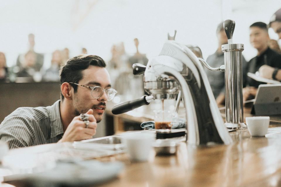 Barista preparing coffee at an espresso bar