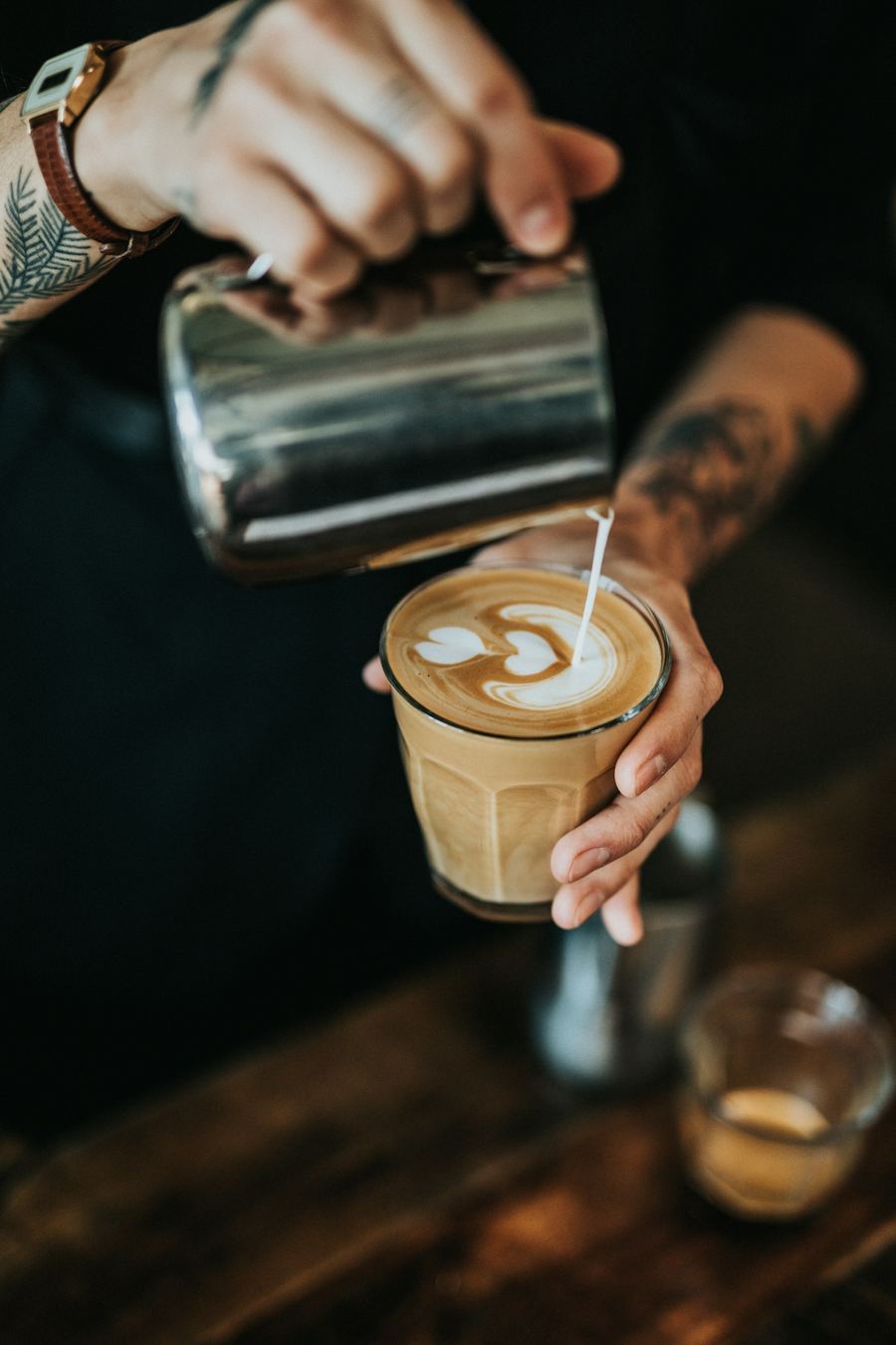 Barista pouring latte art